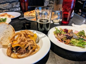 food on a table with a beer