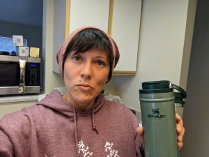 christina holding a stanley mug